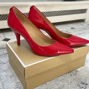 Michael Kors Red Lacquer Pupms. Brand new. Never worn.